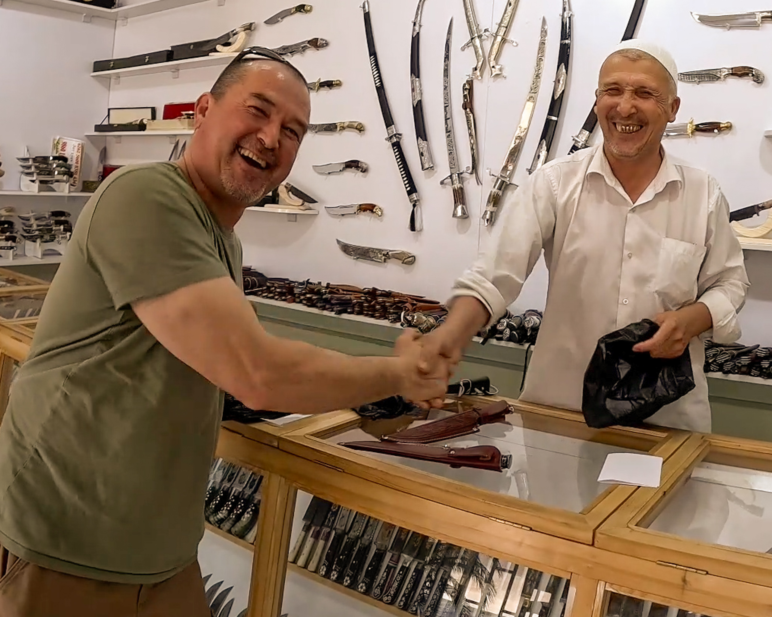 Buck in conversation with a local craftsman